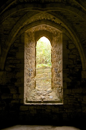 Arched window and vaulting in Battle Abbeyの写真素材