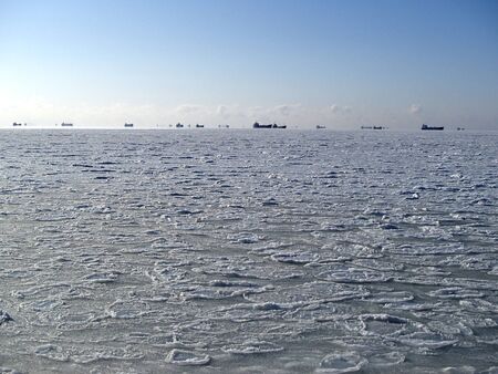 Ships stuck in ice in the northern winter seaの写真素材