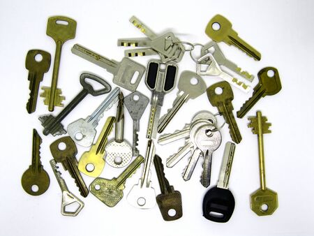 Many different old used keys on white background