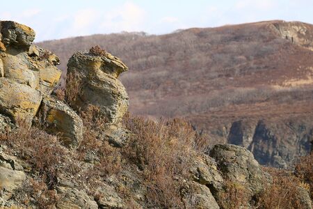 Strange rocks on Japan Sea coast in sunny autumn day. Russky island, Tobizina Cape, Vladivostok, Russia.の写真素材
