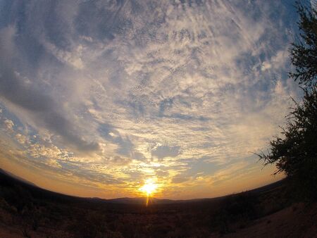 Sun rising over mountains