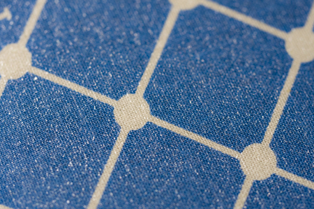 Background of the texture of the fabric. Cell pattern.
