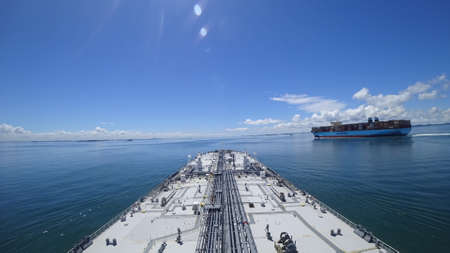 container ship maersk overtakes the oil market, view from the navigational bridge