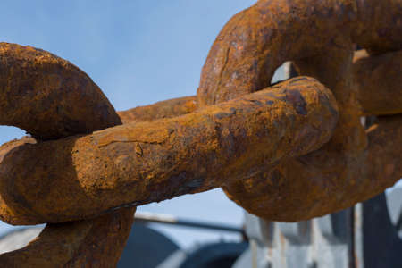 Ship rusty anchor chain on a winchの写真素材
