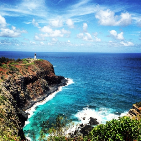 Beautiful scenery overlooking a lighthouse on the island of Kauai Hawaii.の素材
