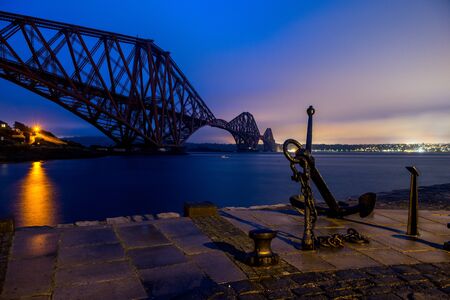 A blue night sky over the Forth bridge in Scotland