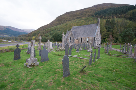 A peaceful graveyard by a Scottish lochの写真素材