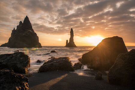 Rock formations on the shore in Icelandの写真素材