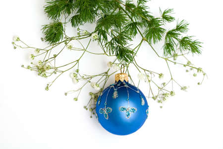 blue christmas ball on the green branch. Isolated, white backgroundの写真素材