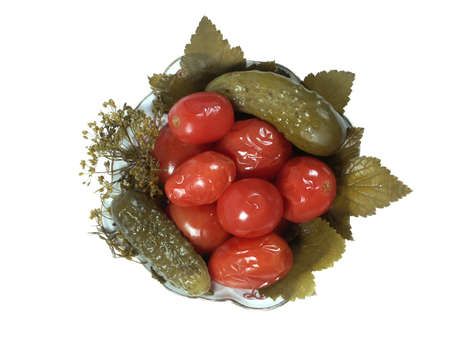 pickle tomatoes and cucumbers on the saucer. Isolated on white background with clipping-pathの写真素材