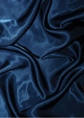 Background made of dark blue wrinkled velvetの写真素材