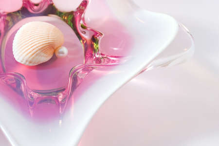 glass crystal vase with shell and perl on it. With copy space.の写真素材