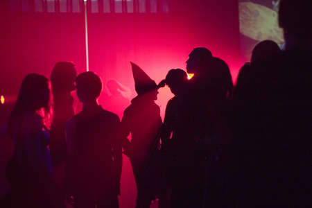 crowd of dancing people in the night clubの写真素材