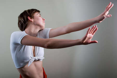 Attractive young woman doing exercises. With copy spaceの写真素材