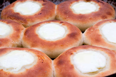 fresh tasty home-baked cheesecakes on the baking sheetの写真素材