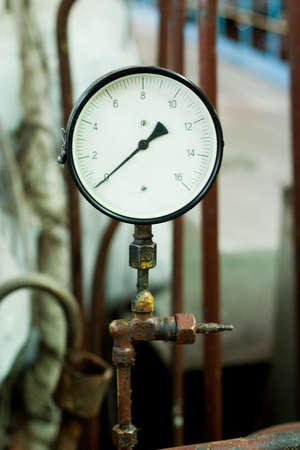antique pressure control device on the rusty pipeの写真素材