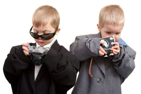 Two boys in business wear with cine and photo camerasの写真素材