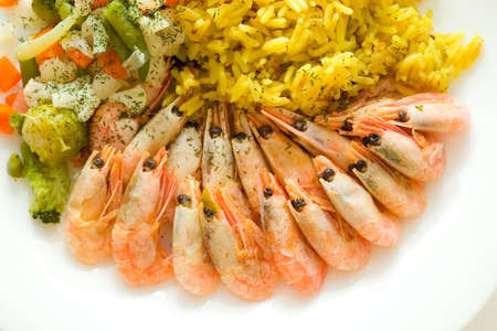 rice, shrimps and vegetables on the white plate. Closeupの写真素材