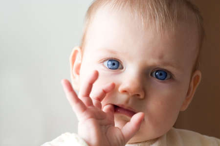 cute little girl in the light of sunの写真素材