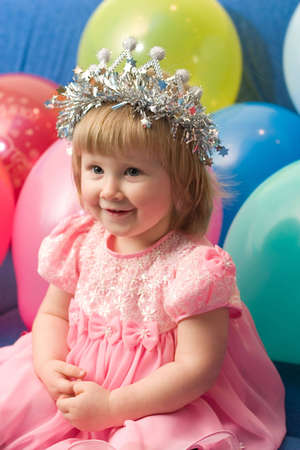portrait of cute little girl with balloonsの写真素材
