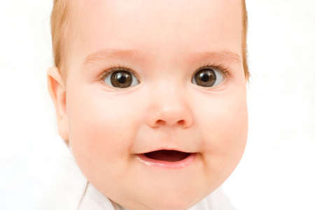 cute little baby looking into camera and smiling