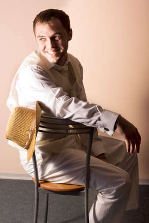 Young groom in wedding wear. Special 	pink toned photo f/xの写真素材