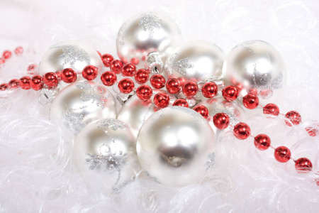 White christmas balls and red beads, on Santa's beardの写真素材