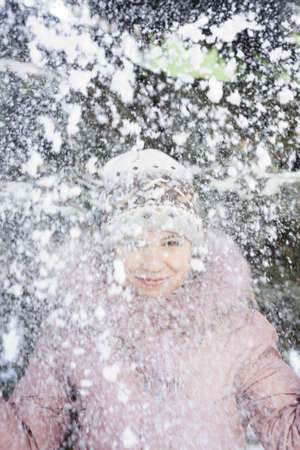 Beautiful girl enjoying fresh snowの写真素材