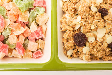Muesli and candied fruits on white background. Healthy food image seriesの写真素材