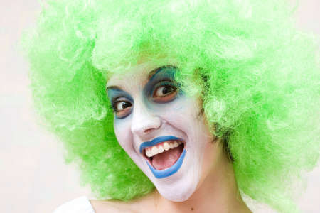spooky female clown in heavy stage make-upの写真素材