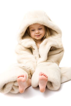 Cute little girl in the fur jacketの写真素材