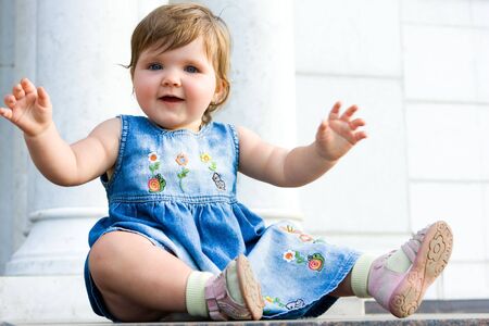 Portrait of pretty one year baby outdoorsの写真素材