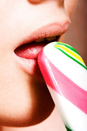 Close-up of young beautiful girl with ice-cream
