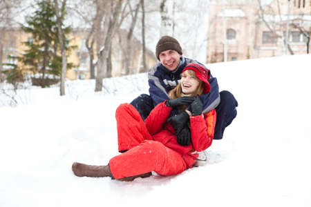 Happy young couple outdoors, winter day. Focal point on girl's faceの写真素材