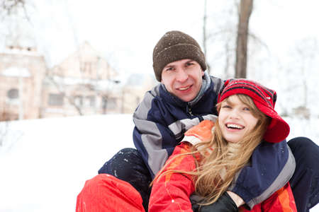 Happy young couple outdoors, winter dayの写真素材