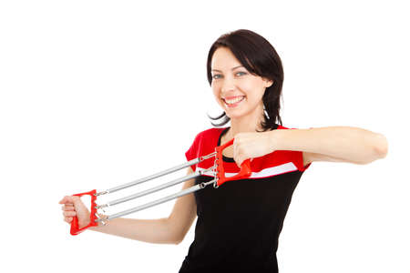 Attractive young woman doing sport exercises. Isolated on white
