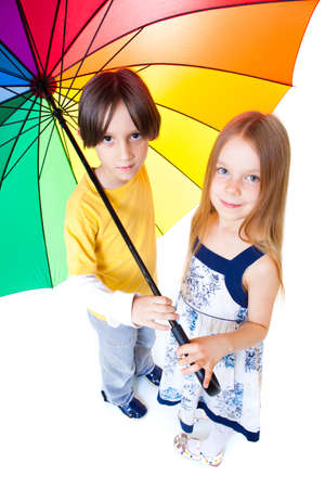 Portrait of two children with colorful umbrellaの写真素材
