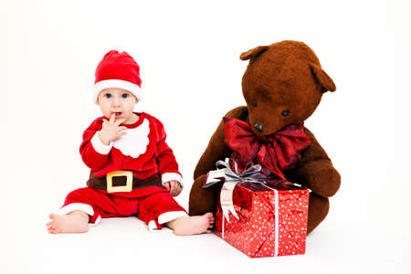 Portrait of cute little boy in Santa Claus costume. Isolated on whiteの写真素材
