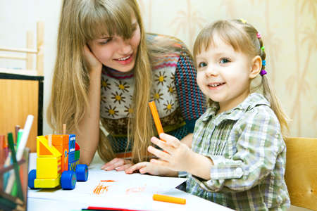 Portrait of cute little girl and her young motherの写真素材