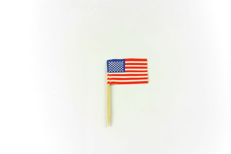 A close-up view of an american flag over white