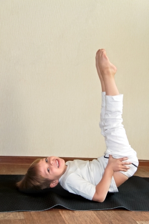 Baby yoga at home の写真素材