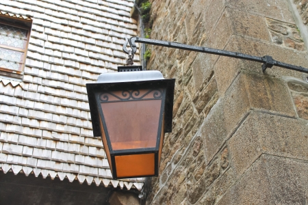 Lantern on the facade of old French house の写真素材