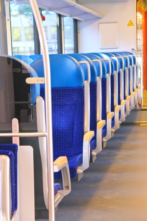 Rows of seats in a passenger train car.のeditorial素材