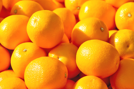 Sale of ripe oranges on the marketの写真素材