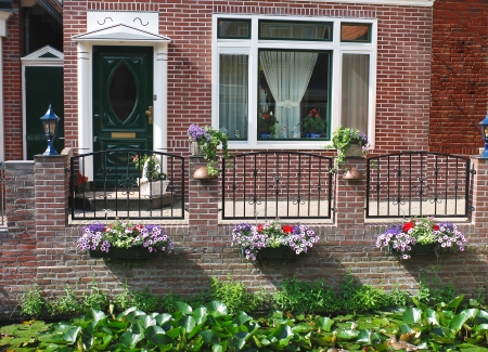 Flowers in front of the Dutch house. Netherlandsの写真素材