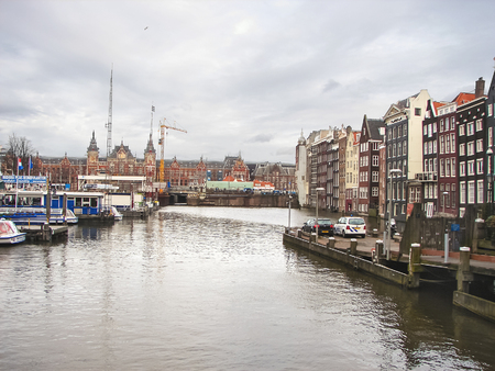 AMSTERDAM,THE NETHERLANDS - FEBRUARY 18, 2012 : City landscape. Mooring of pleasure boats and residential houses on the canal in Amsterdam. Netherlandsのeditorial素材