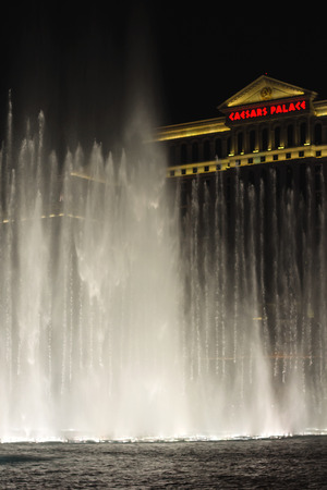 LAS VEGAS, NEVADA, USA - OCTOBER 25, 2013 : Night fountain in front of  Caesar's Palace on the Vegas Strip in Las Vegas, Caesar's Palace hotel opened in 1966 and has a Roman Empire theme.のeditorial素材