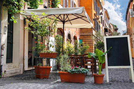 Tables outdoor cafe on a narrow street in Rome, Italyのeditorial素材