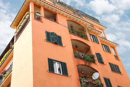 Picturesque Italian house with flowers on the balconiesのeditorial素材
