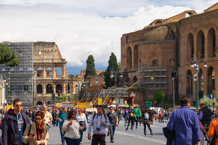 ROME, ITALY - MAY 04, 2014: Tourists visiting the sights in a historical part town near the Colosseum in Rome, Italyのeditorial素材